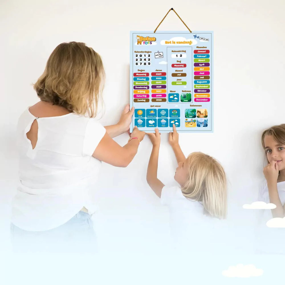 Kinderen gebruiken de DotasToys magnetische kalender en zetten dag, datum, maand en weer met magneten